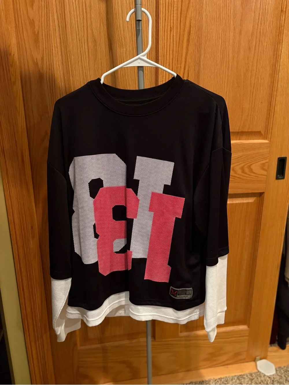 Black and White Layered-Look Long Sleeve Top with Pink Graphic